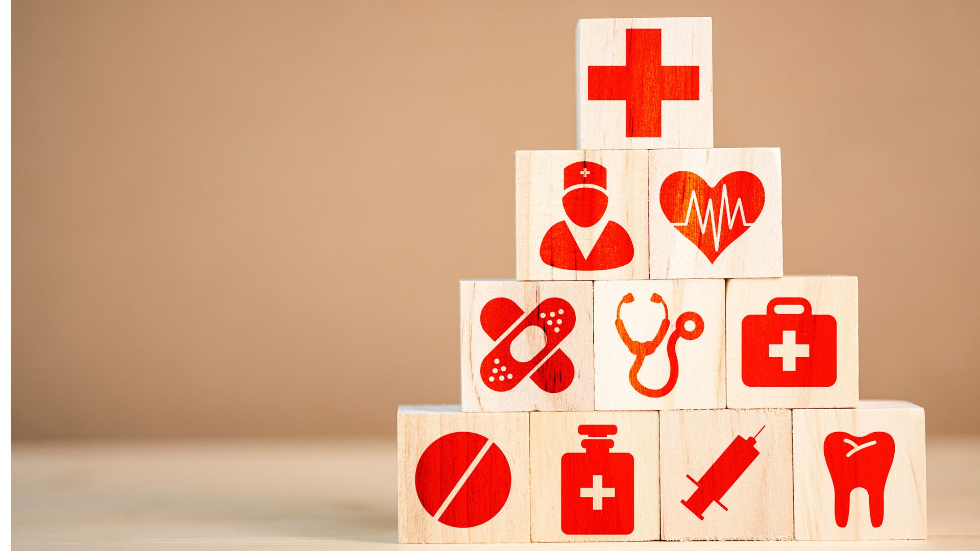 Wooden cubes with healthcare symbols stacked