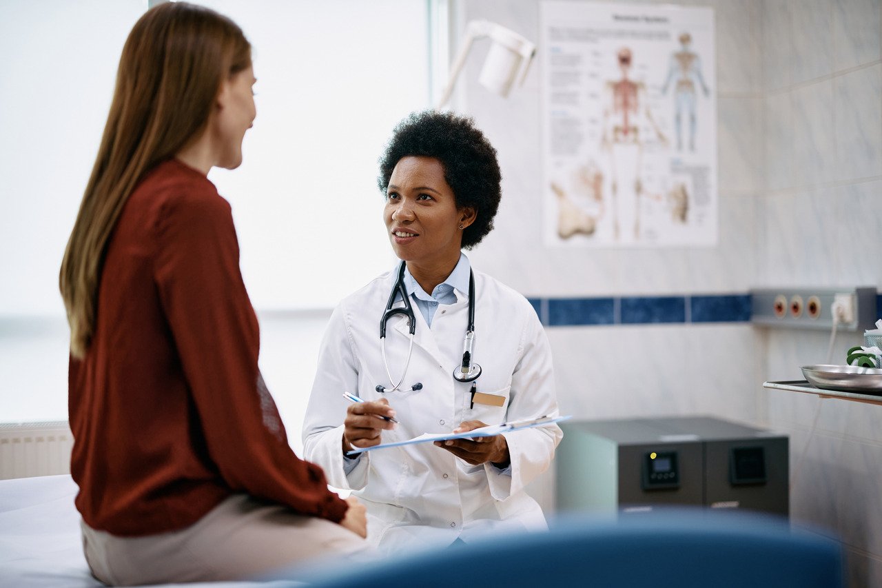 doctor and patient talking during exam 